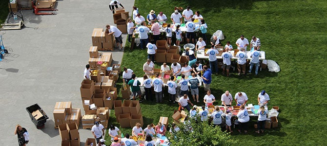 Nu Skin employees assemble back-to-school kits during the 2017 Force for Good day celebration.